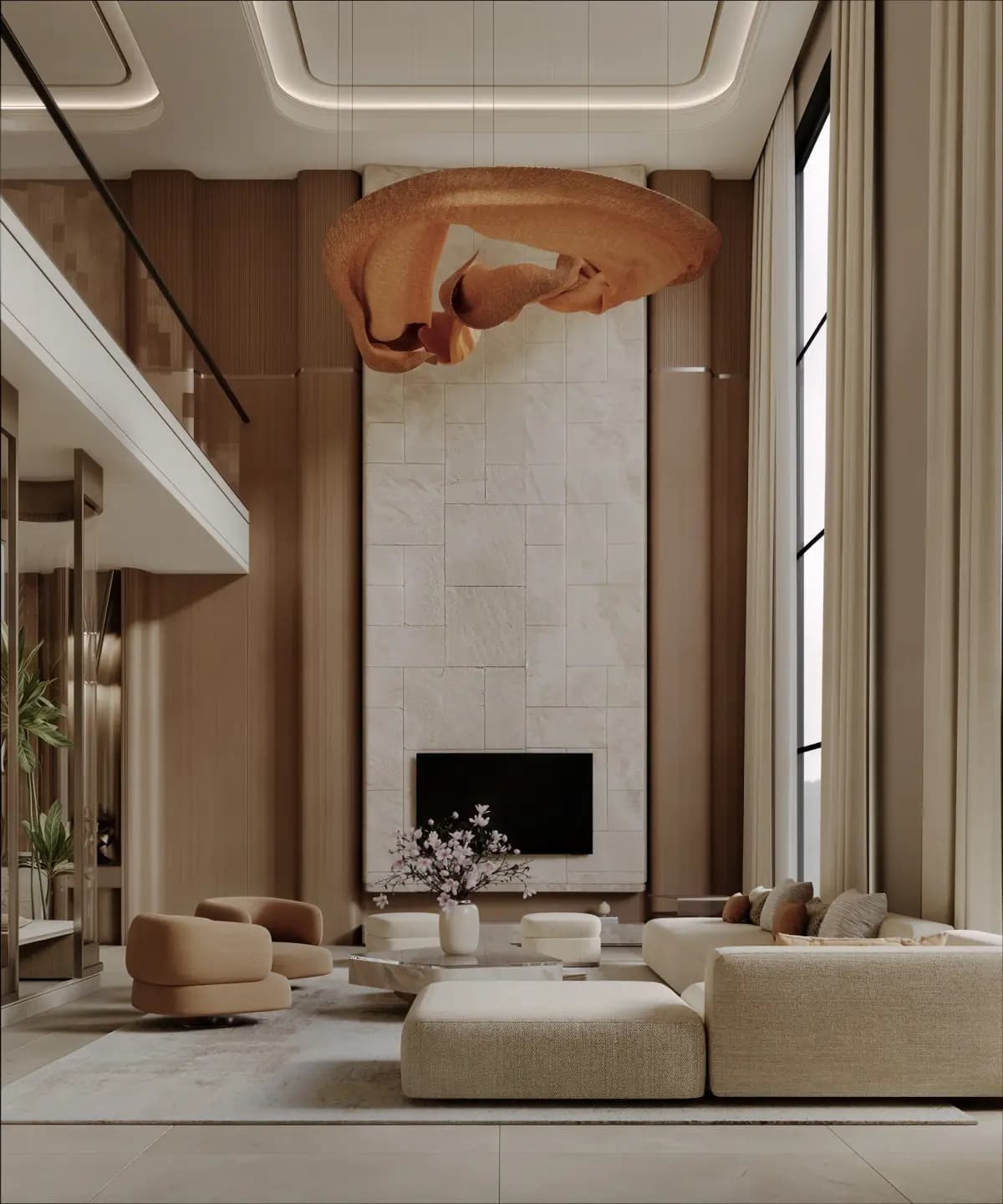 A double-height living room with a cream sectional, stone feature wall and sculptural pendant